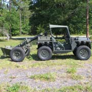 M1163 towing a Mortar